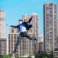 Businessman falling in city center